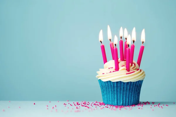 Birthday cupcake with pink candles — Stock Photo, Image