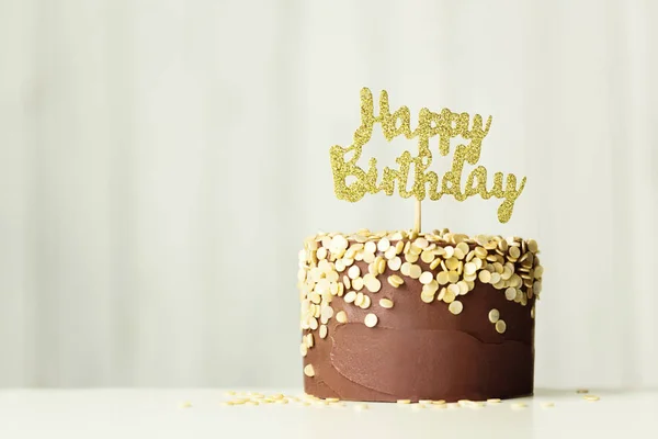 Chocolate and gold birthday cake — Stock Photo, Image