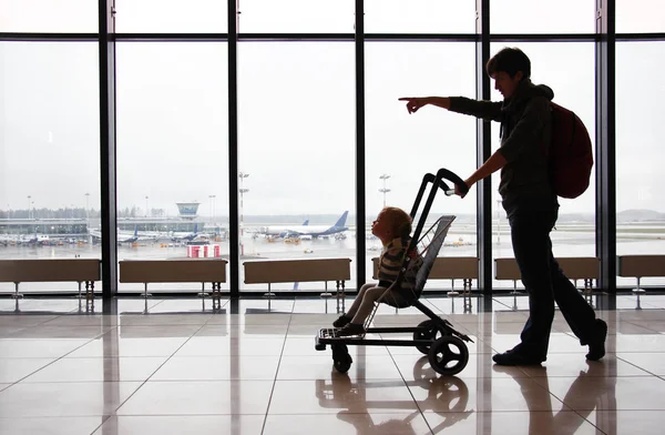 Silhouette Mother Her Toddler Son Stroller Window Airport Mom Points — Stock Photo, Image