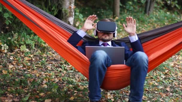 Businessman Laptop Working Hammock Puts Glasses Using Hands Operating Virtual — Stock Video