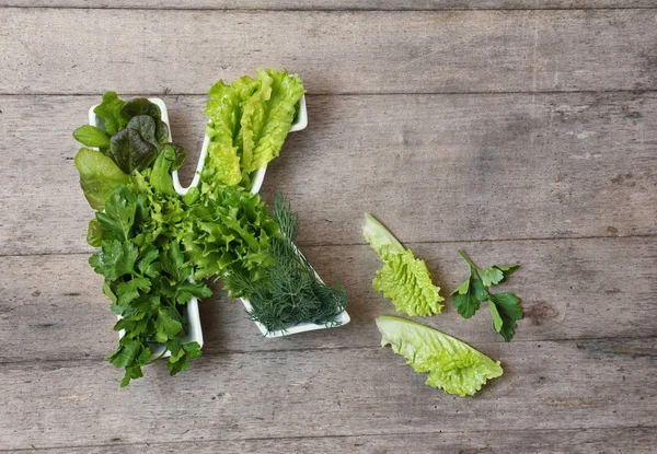 Vitamin K in food concept. Plate in the shape of the letter K wi — Stock Photo, Image