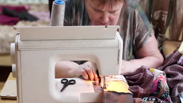 Mature Woman Sews Patchwork Quilt Sewing Machine Front View — Stock Video