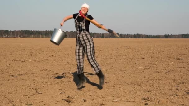 Cheerful Caucasian Woman Farmer Gardener Shovel Bucket Jumps Freshly Plowed — Stock Video