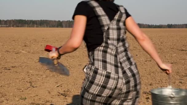 Rear View Female Farmer Shovel Bucket Runs Away Camera Freshly — Stock Video