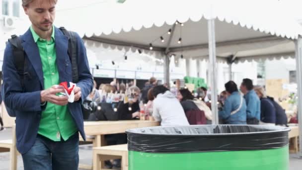 Adult Man Throws Garbage Trash Bin City Festival Handsome Guy — Stock Video