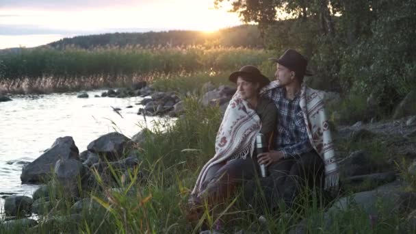 Couple Tourists Man Woman Sits Lake Sunset Wrapped Wool Blanket — Stock Video