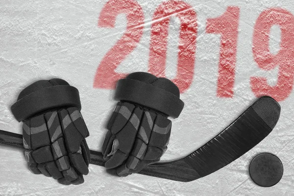 Hockey stick, gloves and washer in the ice arena. Concept, hockey, season, wallpaper