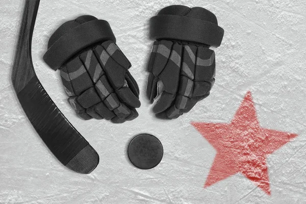 Hockey stick, gloves and washer in the ice arena. Concept, hockey, season, wallpaper