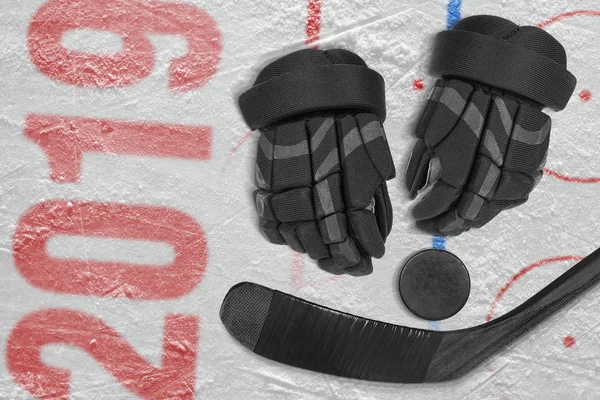 Hockey stick, gloves and puck on the ice. Concept, hockey, season, wallpaper