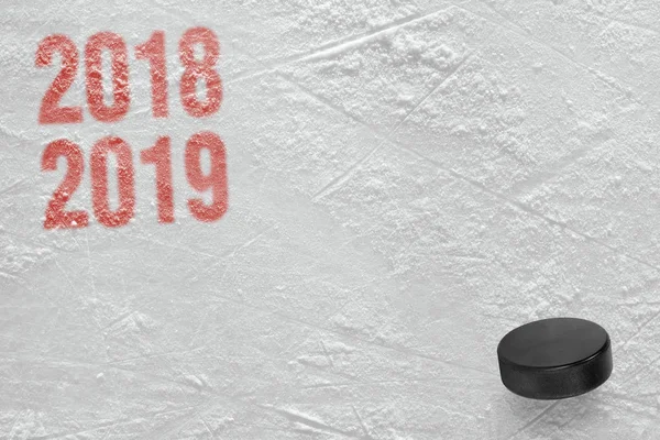 Puck on the ice arena, the season 2018-2019 year. Concept, hockey, wallpaper