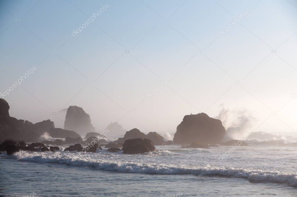 Waves crushing on sea stucks at Cannon Beach, Oregon