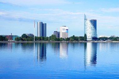 RIGA, LATVIA - AUGUST 29, 2018:  Skyline view of left bank, Kipsala island - Z-Towers (left) and Swedbank tower (right) clipart