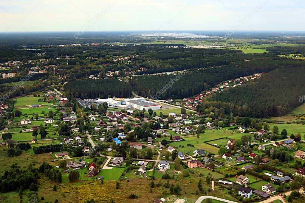 Aerial view over countryside in Latvia near Riga and Gulf of Riga