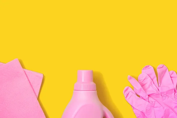 Pink Rag Plastic Bottle Rubber Gloves Yellow Background Cleaning Concept — Stock Photo, Image