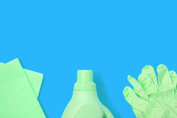 Green Rag Plastic Bottle Rubber Gloves Blue Background Cleaning Concept — Stock Photo, Image