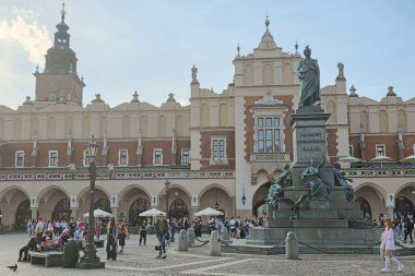 Krakow, Poland - April 23, 2025: View on the main market Square, Rynek Glowny and Adam Mickiewicz Monument