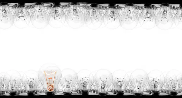 Photo Light Bulbs Rows Shining One Them White Background Concept — Stock Photo, Image