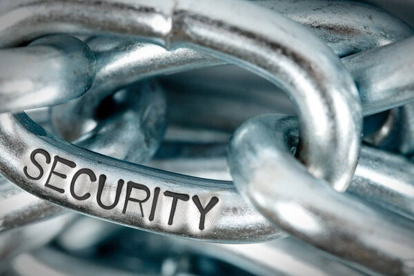 Photo of chains abstract closeup with SECURITY concept word imprinted on metal surface
