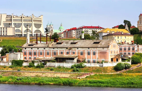 Old industrial facility on the riverbank — Stock Photo, Image