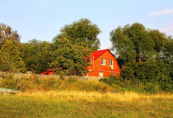 Two-storeyed rural wooden house — Stock Photo, Image