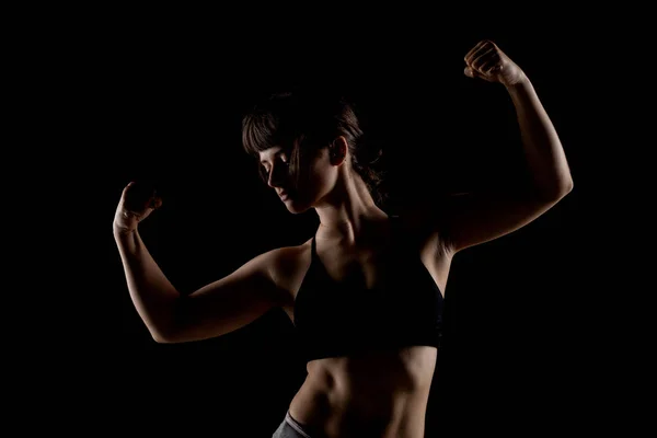 Sexy Brunette Girl Shadows Showing Her Muscles — Stock Photo, Image