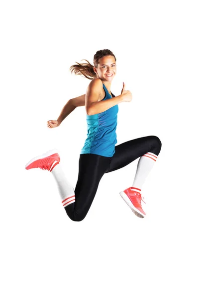 Fittes Läufermädchen Springt Mit Glücklichem Gesichtsausdruck Vor Weißem Hintergrund — Stockfoto