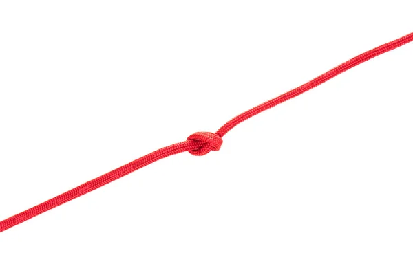 Красные шнурки с узлом — стоковое фото