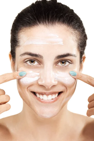 Happy girl with cream on her face — Stock Photo, Image