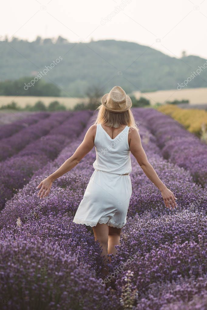 Carefree woman enjoy life at lavender field