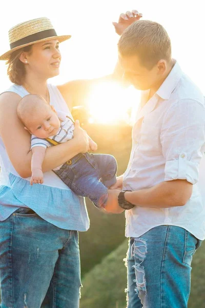 Happy family spending time together at sunset — Stock Photo, Image