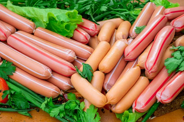 Stack of sausages with greens closeup — Stock Photo, Image