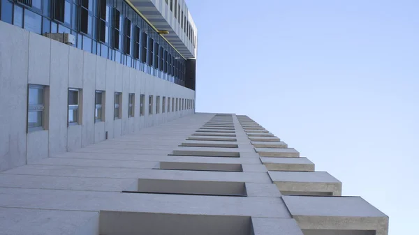 Urban skyscraper on blue sky background — Stock Photo, Image