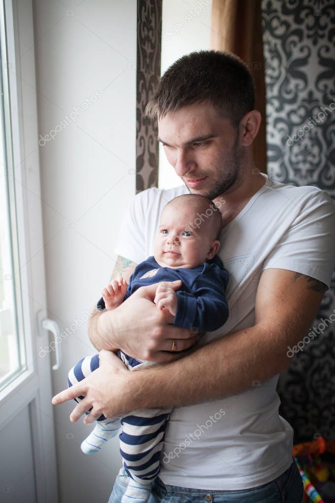 Father holding his little baby