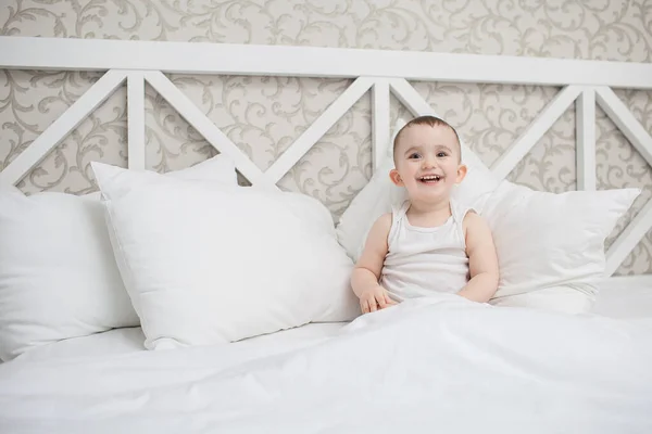 Cute baby boy in bed — Stock Photo, Image
