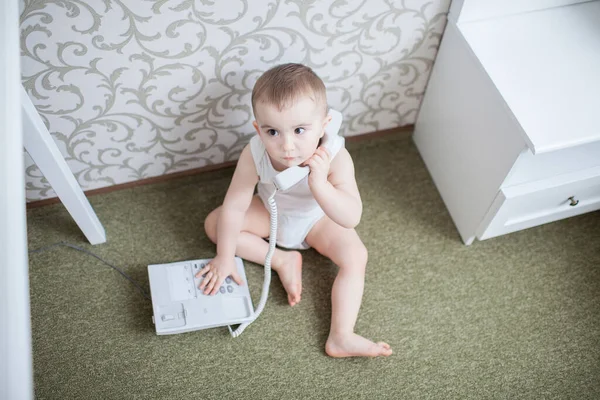 Cute baby boy with telephone — Stock Photo, Image
