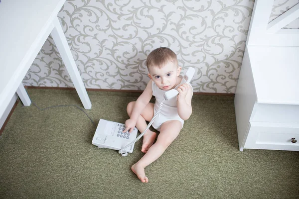 Cute baby boy with telephone — Stock Photo, Image
