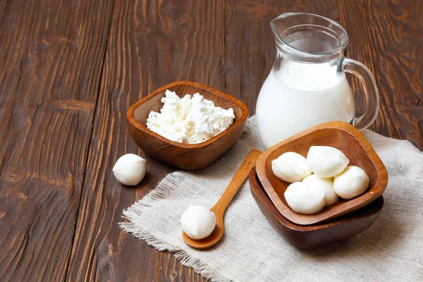 Mozzarella cheese in a wooden bowl on the  table Royalty Free Stock Photos