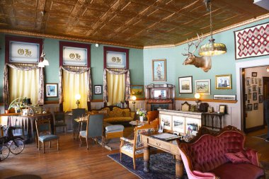 BUFFALO, WYOMING - JUNE 23, 2017: The Occidental Hotel Lobby. Founded in 1880 at the foot of the Bighorn Mountains near the Bozeman Trail, it became one of the most renowned hotels in Wyoming. clipart
