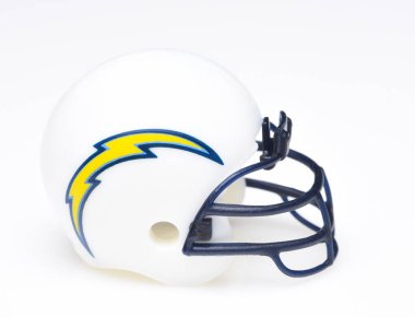 IRVINE, CALIFORNIA - AUGUST 30, 2018: Mini Collectable Football Helmet for the Los Angeles Chargers of the American Football Conference West. clipart