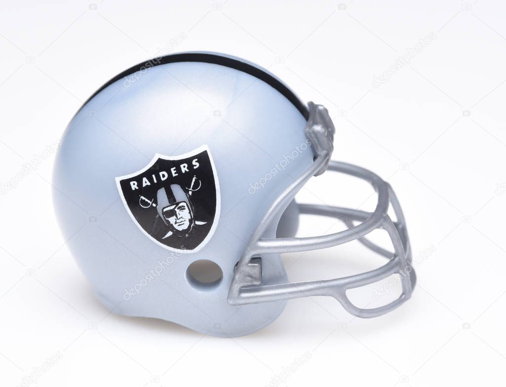 IRVINE, CALIFORNIA - AUGUST 30, 2018: Mini Collectable Football Helmet for the Oakland Raiders of the American Football Conference West.