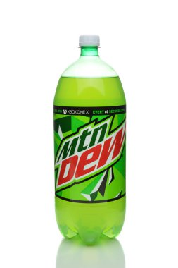IRVINE, CA - JANUARY 4, 2018: MTN Dew bottle Closeup on ice. Mountain Dew is a carbonated citrus soft drink produced and owned by PepsiCo. clipart