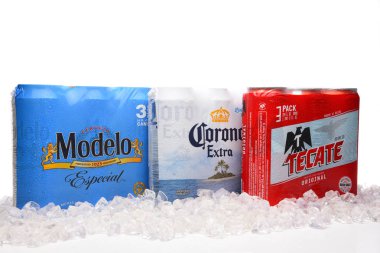 IRVINE, CALIFORNIA - MARCH 21, 2018: Three packs of 24 ounce Mexican Beers. Modelo Especial, Corona Extra and Tecate Original with ice. clipart