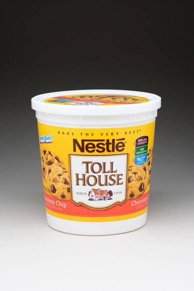 IRVINE, CA - January 11, 2013: A 5 pound tub of Nestle Toll House Cookie Dough. The popular cookie recipe was developed in the 1930's by Ruth Graves Wakefield of the Toll House Inn.