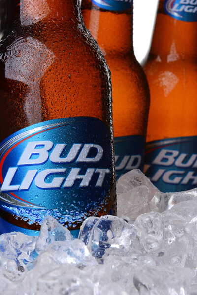 IRVINE, CA - MAY 30, 2014: Closeup of three Bud Light Beer Bottles in ice. From Anheuser-Busch InBev, Bud Light is the top selling domestic beer in the United States.