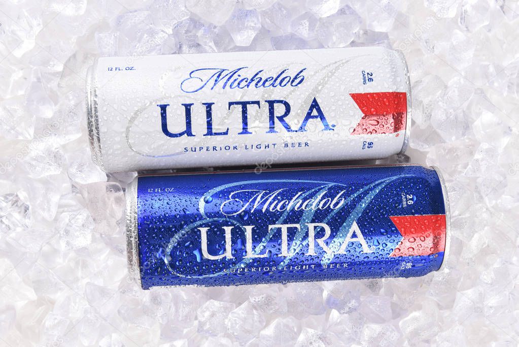 IRVINE, CA - AUGUST 6, 2018: Two Michelob Ultra beer 12 ounce cans in ice. A a low carb and low calorie light beer from Anheuser-Busch.