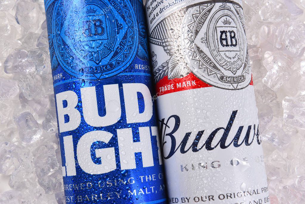 IRVINE, CALIFORNIA - MARCH 21, 2018: Budweiser and Bud Light King Cans on ice closeup. Budweiser and Bud Light are two of the most popular beers in the U.S.
