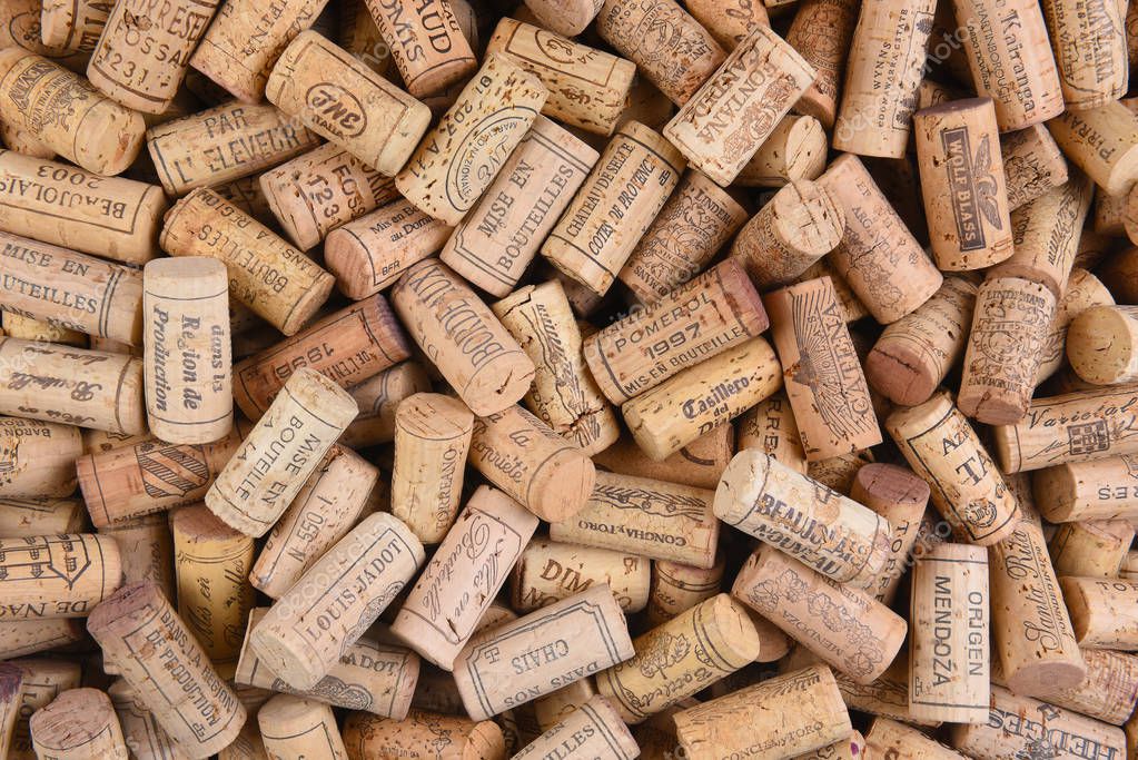 IRVINE, CALIFORNIA - FEBRUARY 14, 2018: A pile of imported wine corks from a variety of wineries and countries.