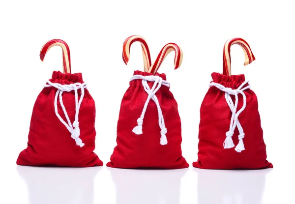 Três Sacos Vermelhos Brinquedo Papai Noel Com Uma Sequência Caracteres — Fotografia de Stock