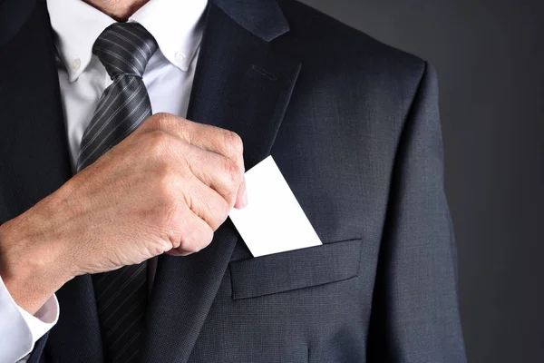 Closeup Businessman Putting Blank Business Card His Jackets Breast Pocket — Stock Photo, Image