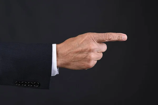 Closeup Mans Hand Pointing Dark Suit Dark Gray Background — Stock Photo, Image